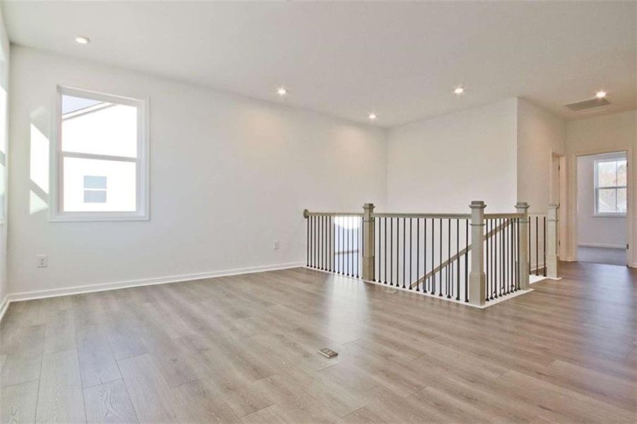 Spacious, unfurnished interior of a new home in The Paddocks at Doc Hughes, Buford (Image 39).