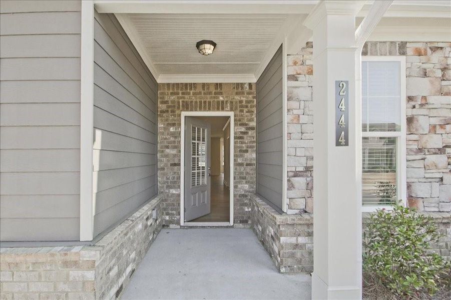 Exterior details and patio area of a home in Cooper's Walk, Loganville (Image 3).
