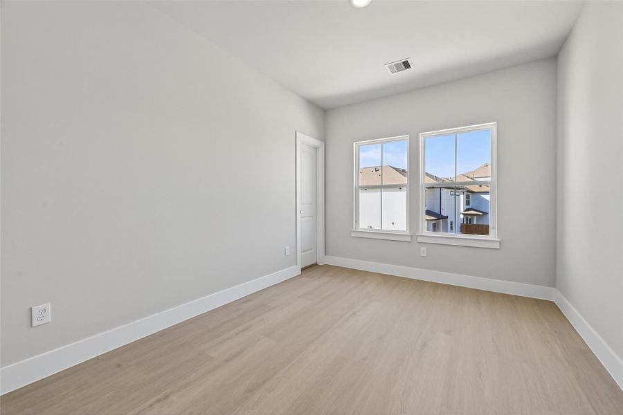 Spacious, unfurnished interior of a new home in Metro Village, Houston (Image 21).