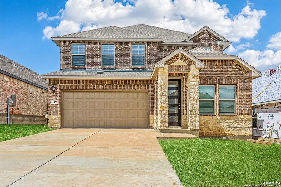 Front exterior of a new home in Arcadia Ridge - Premier Series, San Antonio, TX, highlighting curb appeal (Image 22).