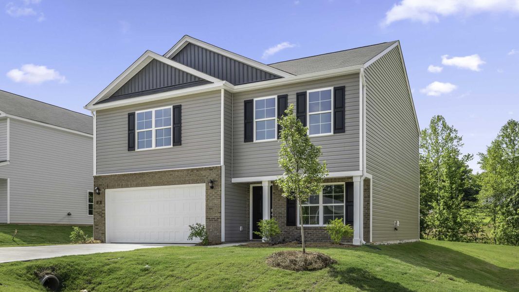 Front exterior of a new home in Greystone North, Stoneville, NC, highlighting curb appeal (Image 15). Front exterior of a new home in Greystone North, Stoneville, NC, highlighting curb appeal (Image 15).