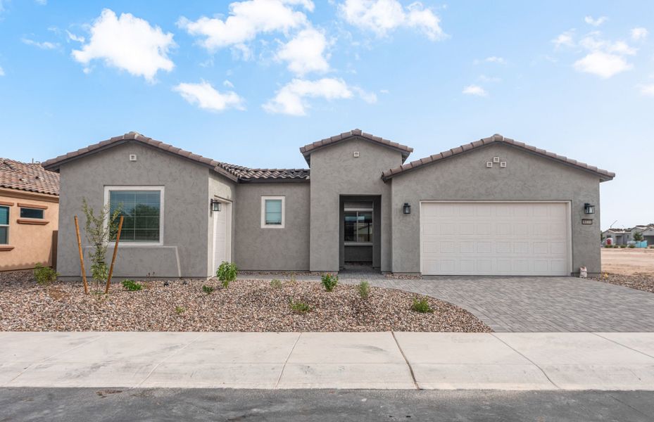 Front exterior of a new home in Sun City Anthem at Merrill Ranch, Florence, AZ, highlighting curb appeal (Image 2). Front exterior of a new home in Sun City Anthem at Merrill Ranch, Florence, AZ, highlighting curb appeal (Image 2).