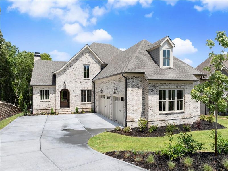 Front exterior of a new home in , Flowery Branch, GA, highlighting curb appeal (Image 2). Front exterior of a new home in , Flowery Branch, GA, highlighting curb appeal (Image 2).