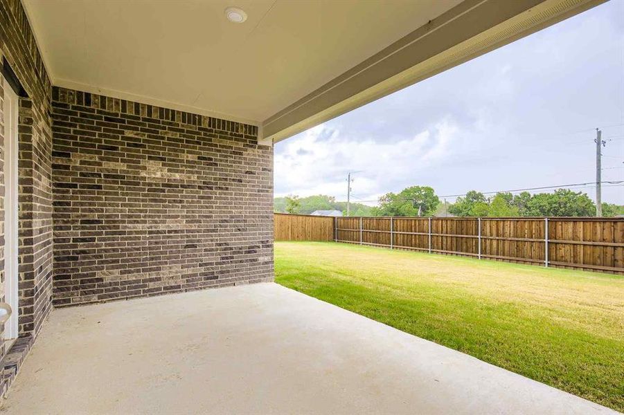 Exterior details and patio area of a home in Prestige Collection at Overland Grove, Forney (Image 15).
