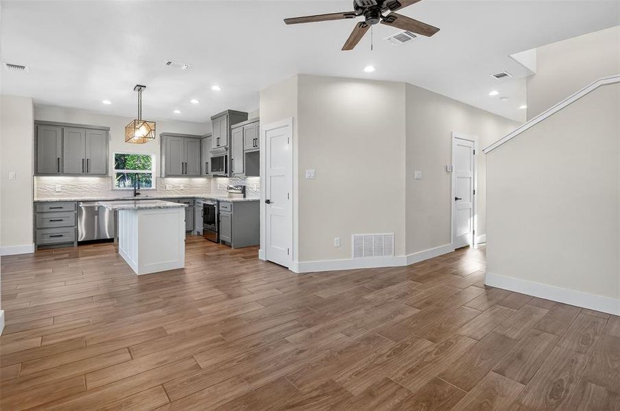 beautiful kitchen with custom cabinets and all electric appliances