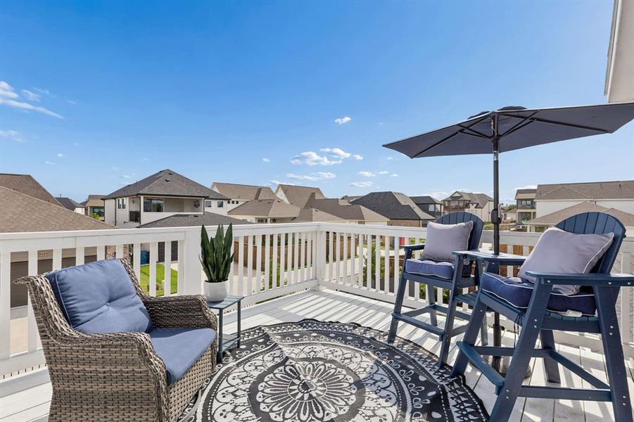 A private elevated retreat offering additional outdoor living space and beautiful water views, perfect for relaxing above the neighborhood and Lake Ray Hubbard.