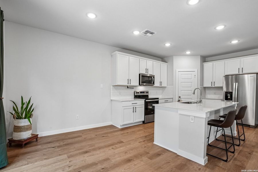 Furnished interior view inside a new home in University Village, San Antonio (Image 10).