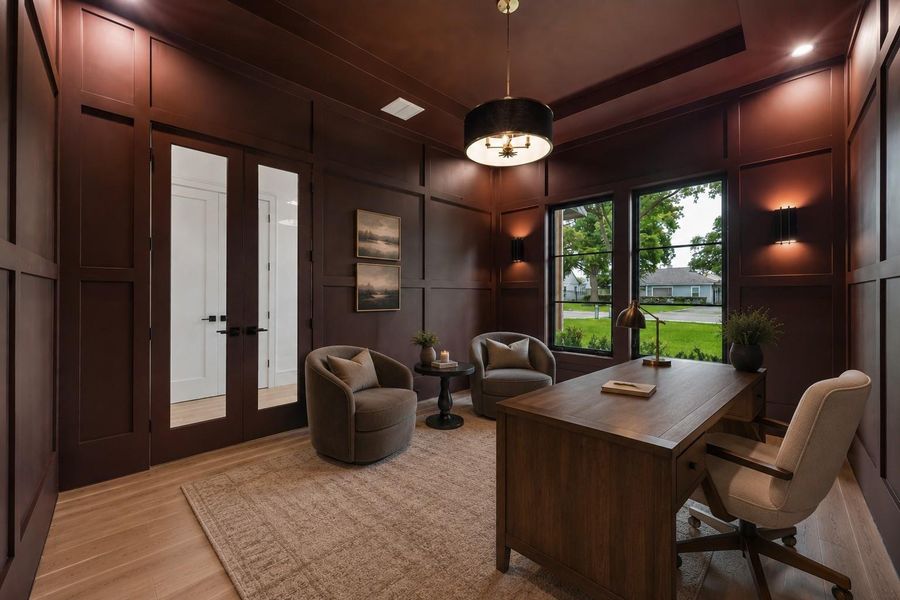 Rich millwork, dramatic ceiling height, and designer lighting create a refined home office designed to inspire. Oversized windows welcome natural light, while the flexible layout offers the perfect balance of productivity and a comfortable place to meet, read, or unwind. **Virtually staged**