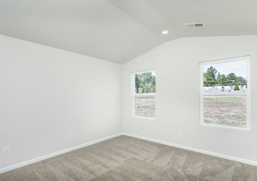 The master bedroom has cathedral ceilings