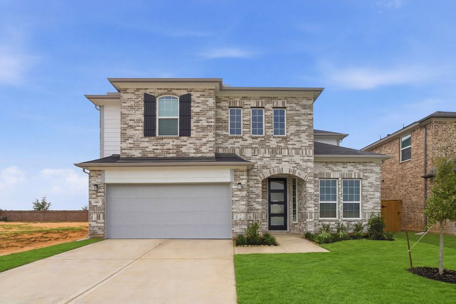 Front exterior of a new home in Sunterra Lakes, Brookshire, TX, highlighting curb appeal (Image 1). Front exterior of a new home in Sunterra Lakes, Brookshire, TX, highlighting curb appeal (Image 1).