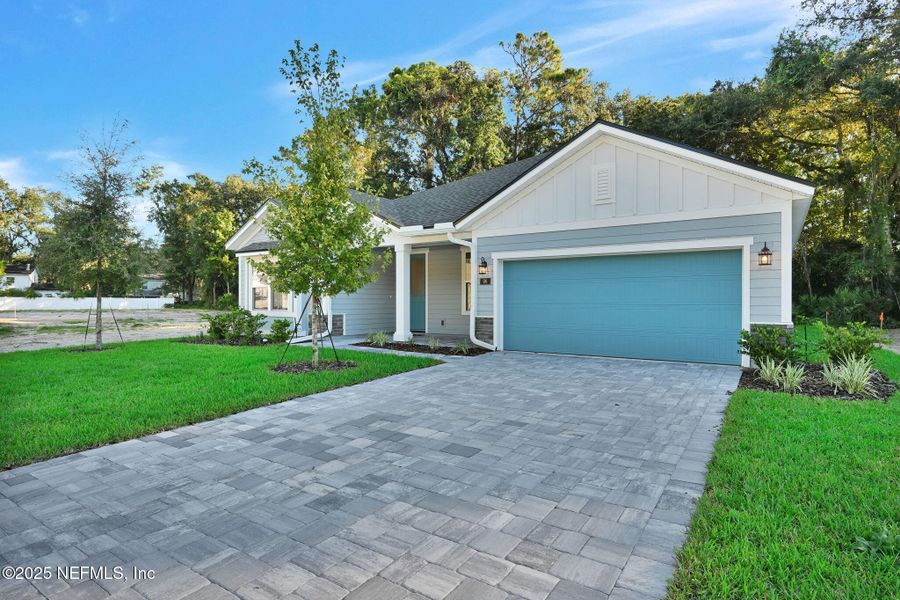 Front exterior of a new home in Landing at Olde Florida, St. Augustine, FL, highlighting curb appeal (Image 1).