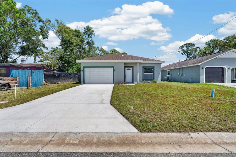 Front exterior of a new home in , Daytona Beach, FL, highlighting curb appeal (Image 18). Front exterior of a new home in , Daytona Beach, FL, highlighting curb appeal (Image 18).