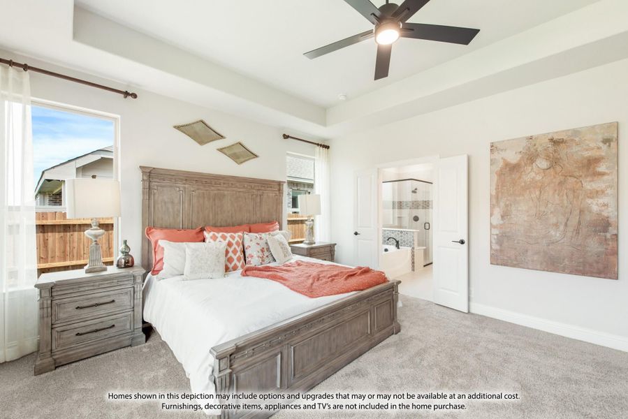 Master bedroom with wood bed frame, ceiling fan, carpet floors, and ensuite bathroom doorway visible. Master bedroom with wood bed frame, ceiling fan, carpet floors, and ensuite bathroom doorway visible.