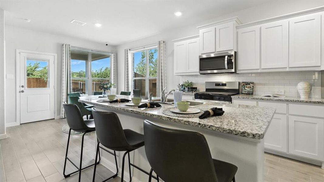 Kitchen - All Home and community information, including pricing, included features, terms, availability and amenities, are subject to change at any time without notice or obligation. All Drawings, pictures, photographs, video, square footages, floor plans, elevations, features, colors and sizes are approximate for illustration purposes only and will vary from the homes as built.