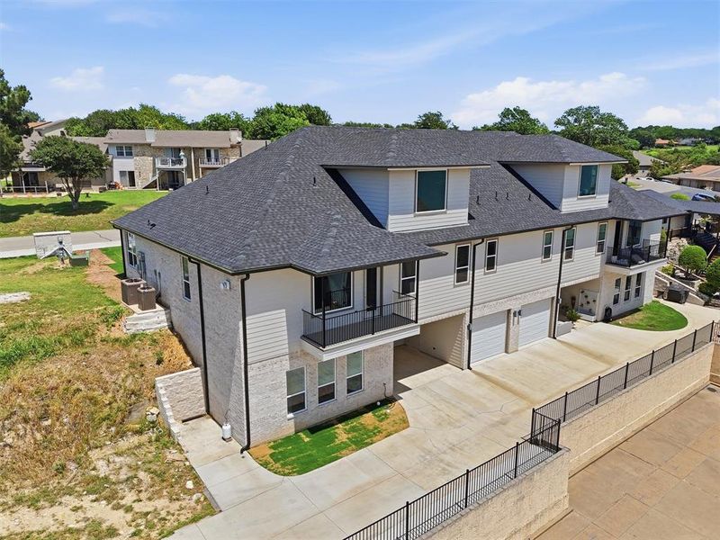Front exterior of a new home in , Granbury, TX, highlighting curb appeal (Image 2). Front exterior of a new home in , Granbury, TX, highlighting curb appeal (Image 2).