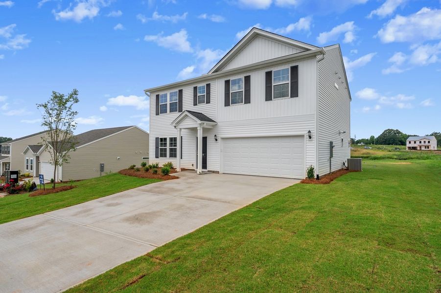 Front exterior of a new home in Radley Place, Chesnee, SC, highlighting curb appeal (Image 2). Front exterior of a new home in Radley Place, Chesnee, SC, highlighting curb appeal (Image 2).