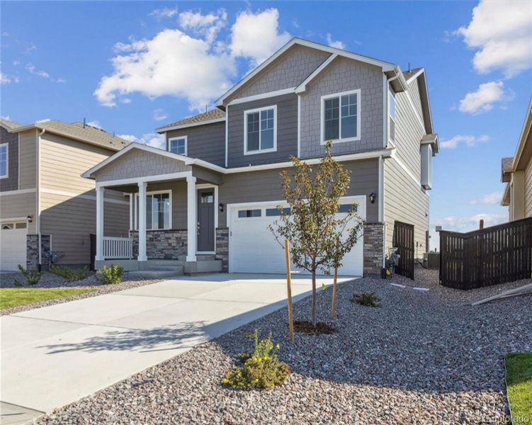 Front exterior of a new home in Settlers Crossing, Commerce City, CO, highlighting curb appeal (Image 19).