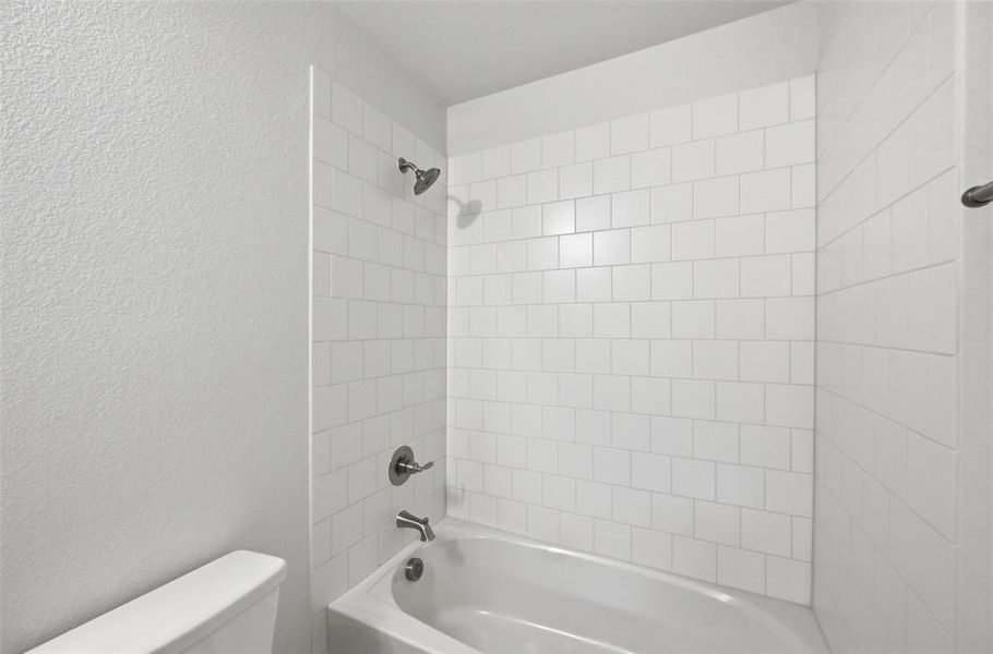 Tile surround in the secondary bathroom Tile surround in the secondary bathroom