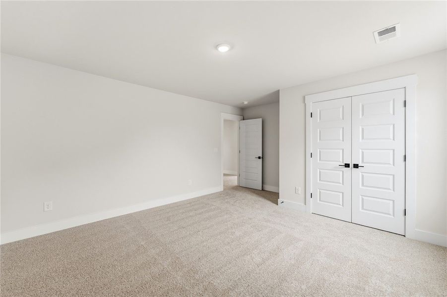 This bright and airy room offers soft carpeting, c