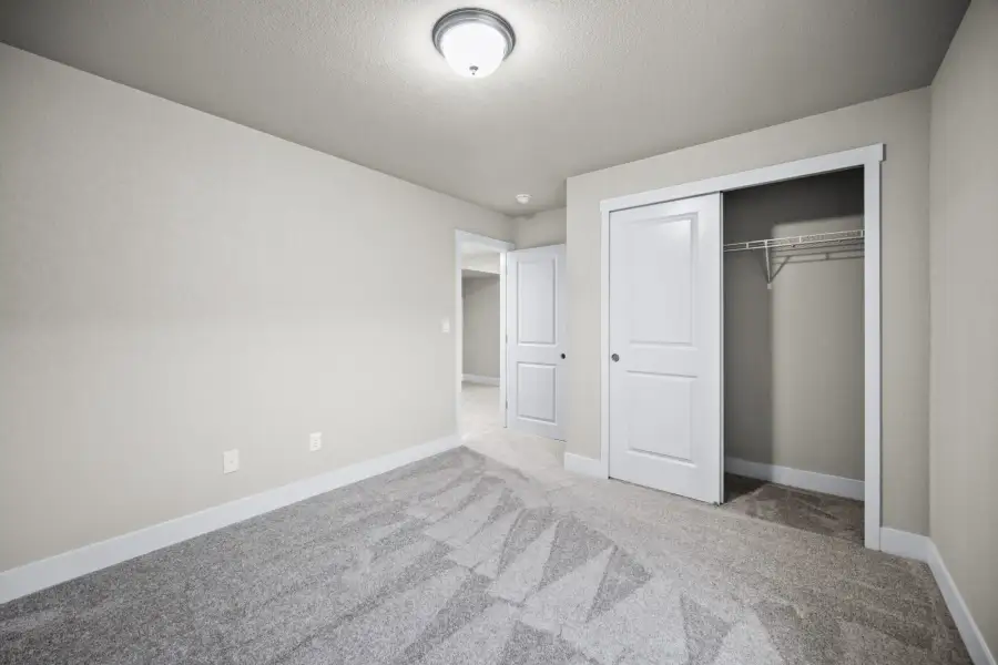 Spacious, unfurnished interior of a new home in The Glen, Colorado Springs (Image 31).