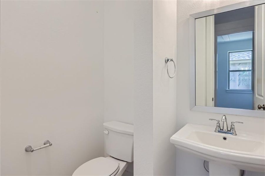 Bathroom with sink and toilet