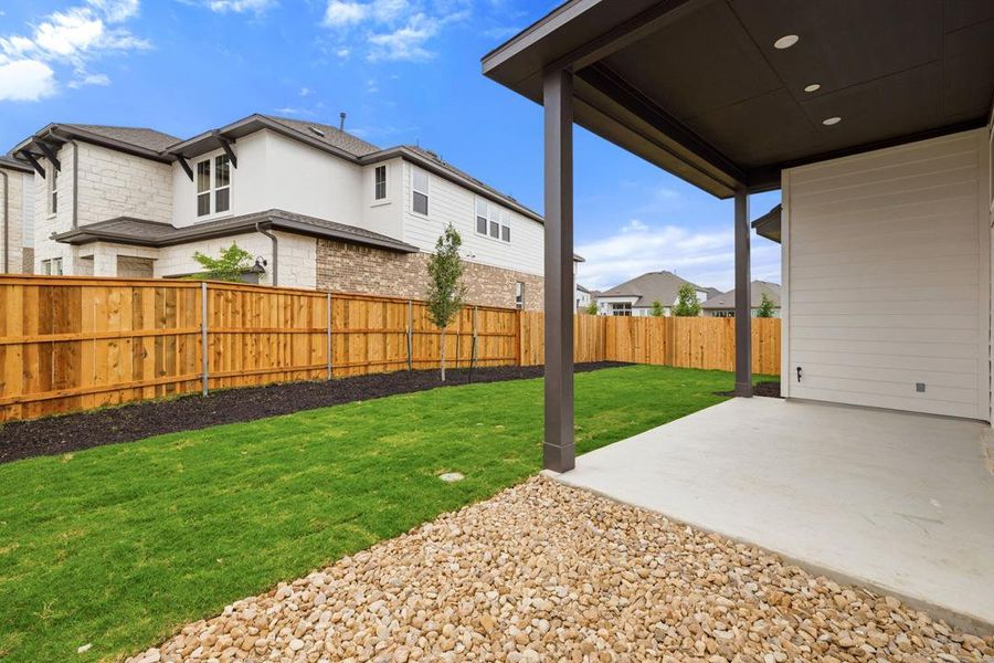 Exterior details and patio area of a home in Heritage, Dripping Springs (Image 26).