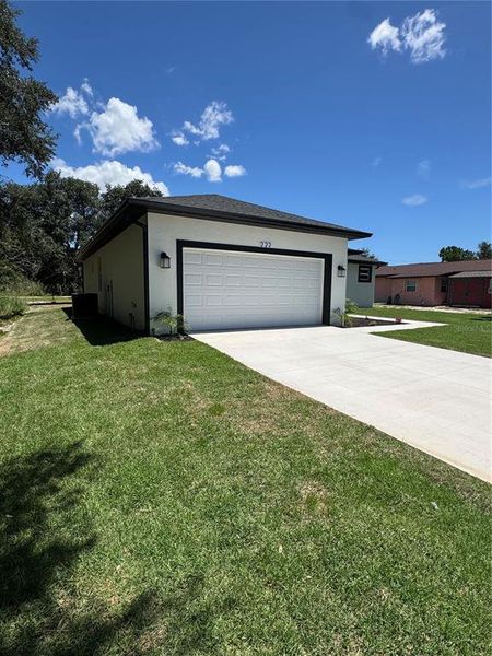 Front exterior of a new home in , Dundee, FL, highlighting curb appeal (Image 20). Front exterior of a new home in , Dundee, FL, highlighting curb appeal (Image 20).
