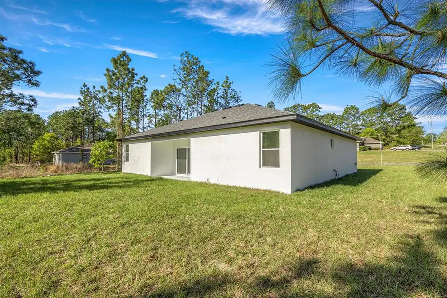 Exterior details and patio area of a home in , Citrus Springs (Image 22).