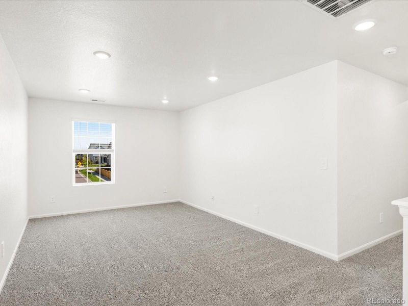 Spacious, unfurnished interior of a new home in Ridgeline Vista: The Flora Collection, Brighton (Image 15).