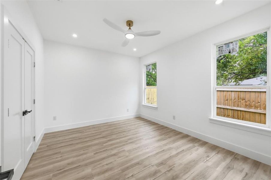 Large primary bedroom towards rear of home Large primary bedroom towards rear of home