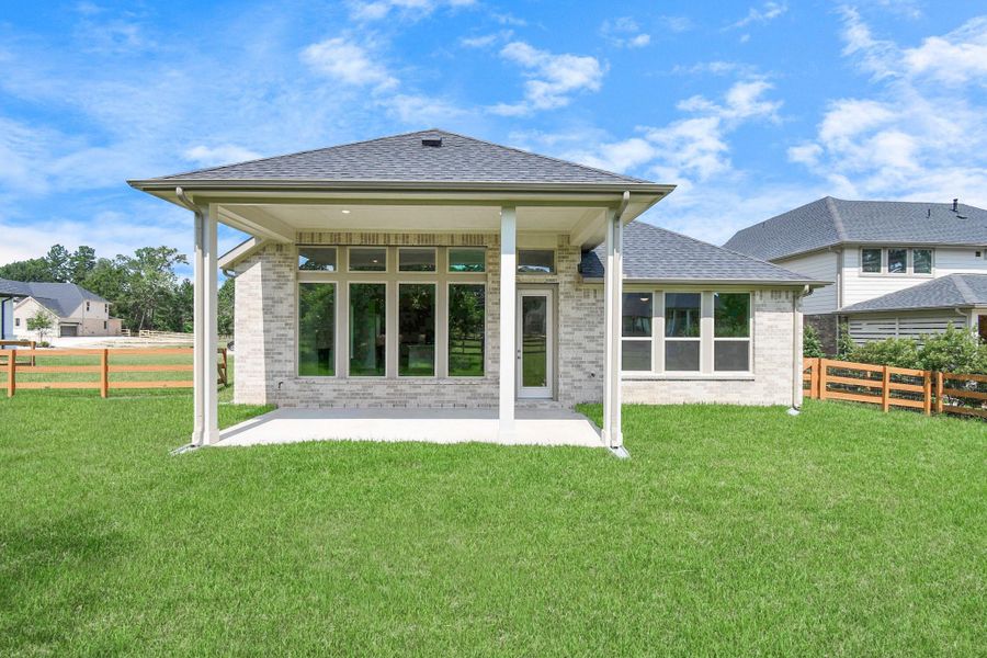 Front exterior of a new home in Timber Hollow: Heritage Collection, Magnolia, TX, highlighting curb appeal (Image 23). Front exterior of a new home in Timber Hollow: Heritage Collection, Magnolia, TX, highlighting curb appeal (Image 23).