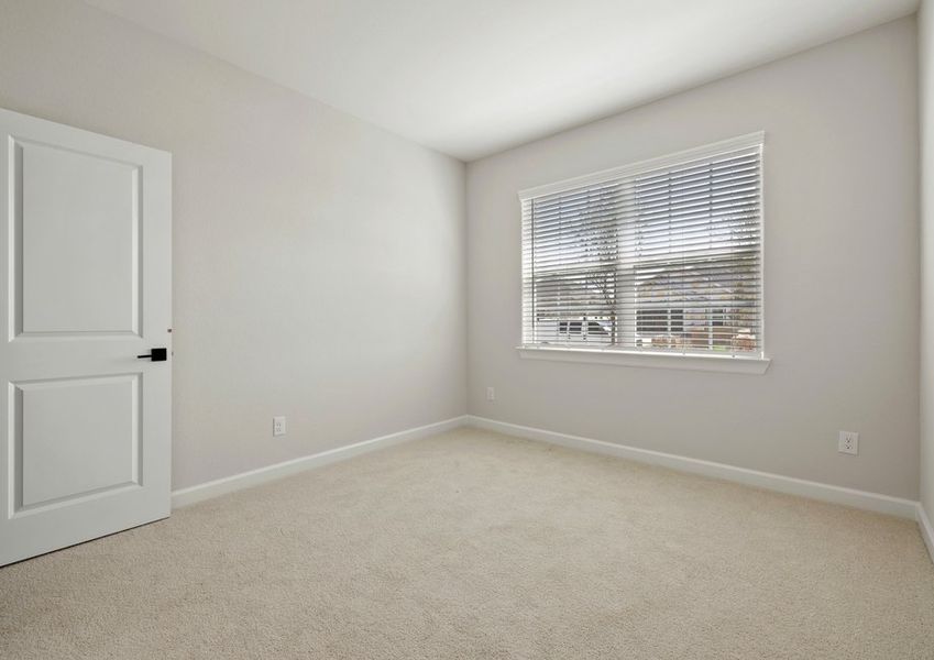 Spacious bedroom with carpet floooring Spacious bedroom with carpet floooring