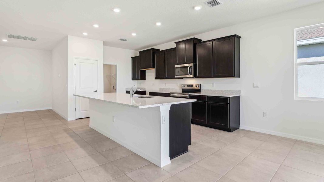 Representative furnished interior of a home built from the Laurel by D.R. Horton in Ocala Preserve, Ocala (Image 8).