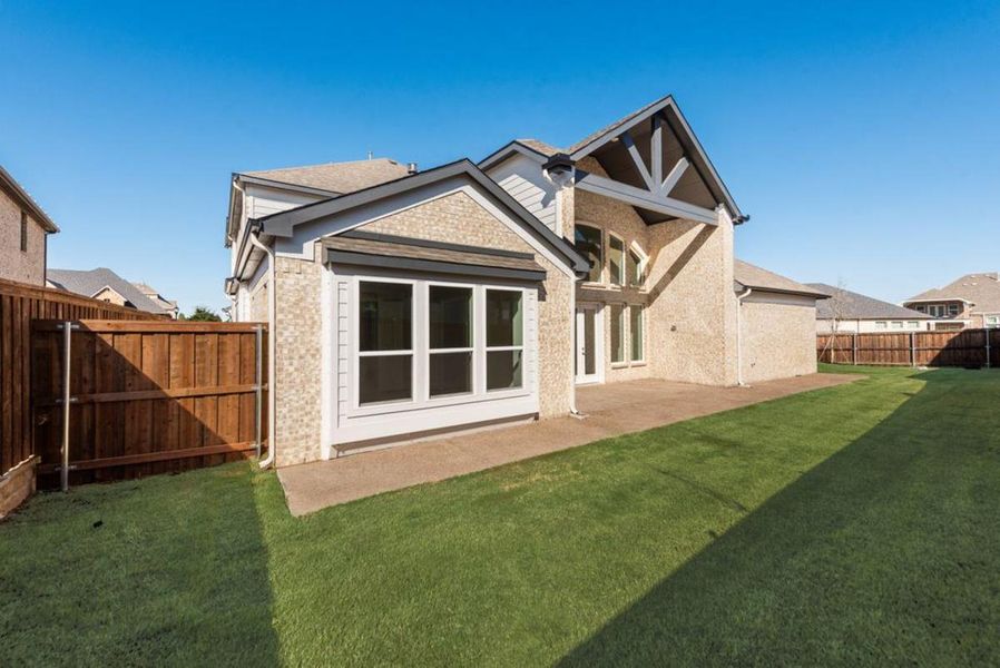 Exterior details and patio area of a home in South Pointe, Mansfield (Image 4).