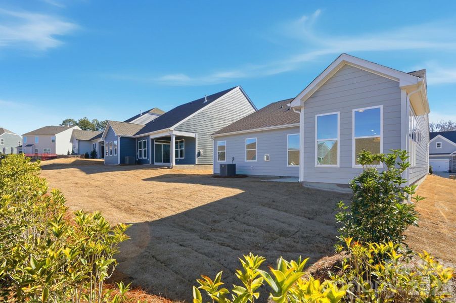 Exterior details and patio area of a home in Villas at Prestwick, Mooresville (Image 22).