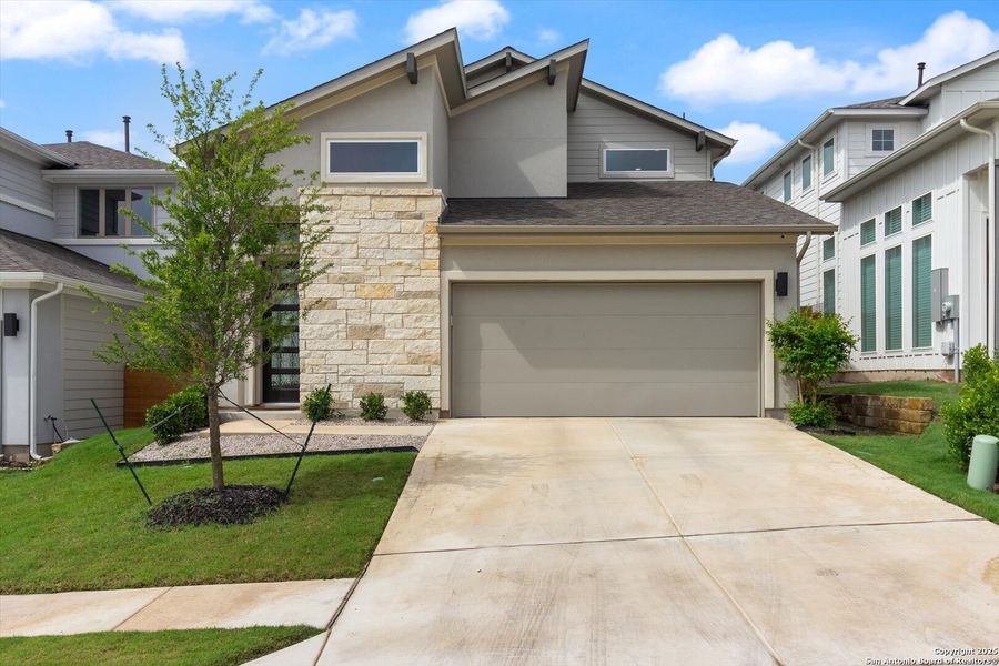 Front exterior of a new home in , Pflugerville, TX, highlighting curb appeal (Image 21).