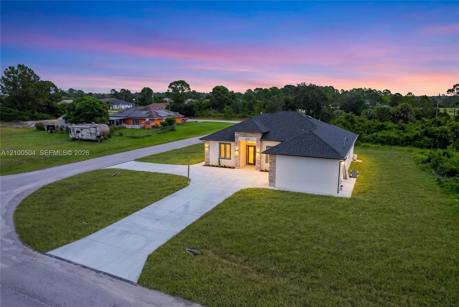 Front exterior of a new home in , Lehigh Acres, FL, highlighting curb appeal (Image 23). Front exterior of a new home in , Lehigh Acres, FL, highlighting curb appeal (Image 23).