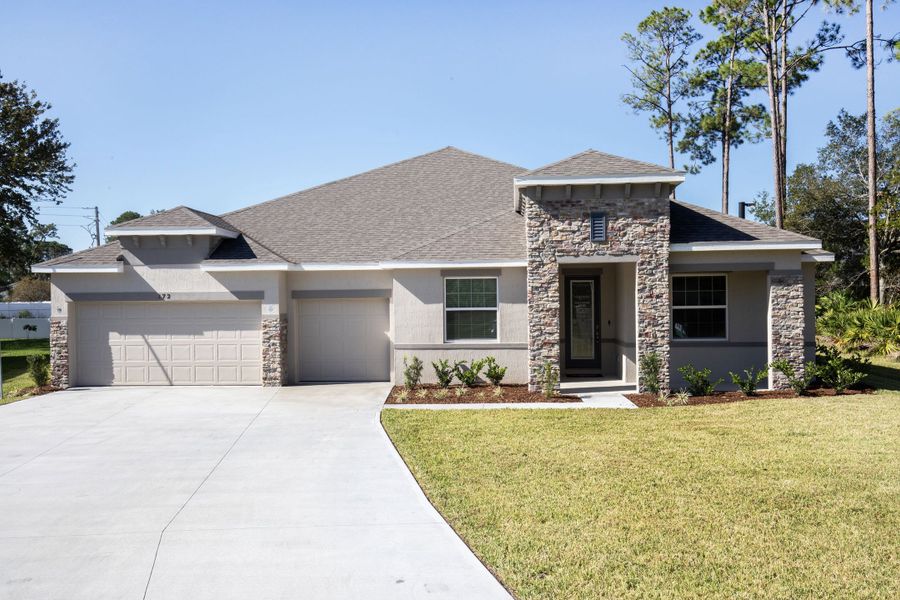 Front exterior of a new home in Sugarmill Woods, Homosassa, FL, highlighting curb appeal (Image 22).