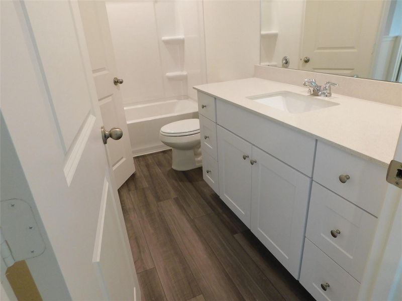 Furnished interior view inside a new home in Royal Pines, Porter (Image 8).