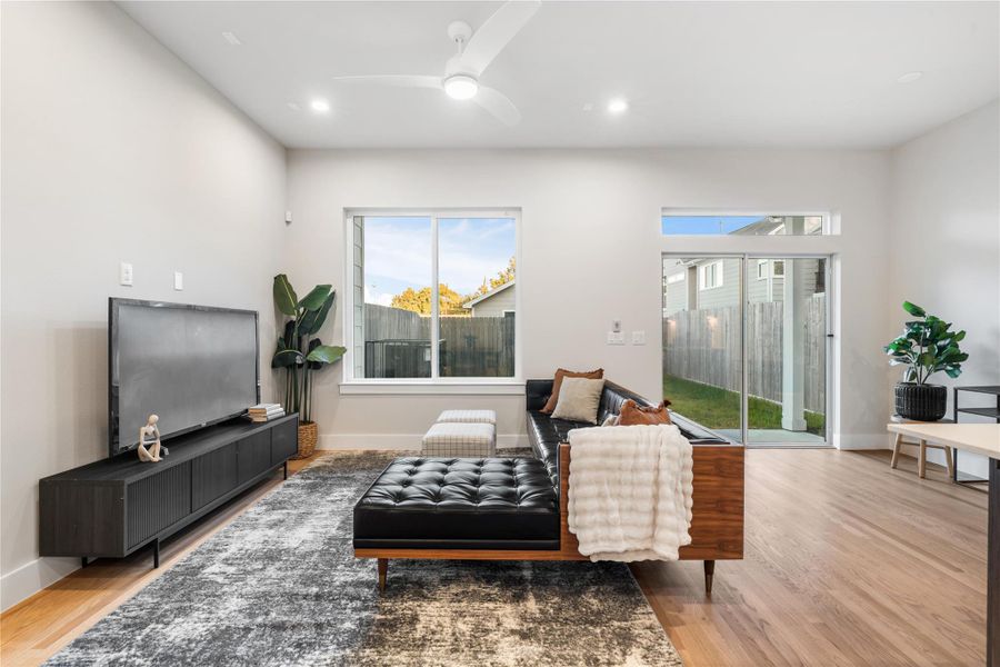 The living room offers clear views of your covered patio and expansive backyard, seamlessly blending indoor comfort with outdoor living. The living room offers clear views of your covered patio and expansive backyard, seamlessly blending indoor comfort with outdoor living.