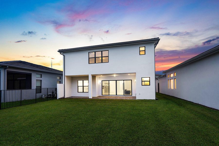 Front exterior of a new home in Lotus Edge, Boca Raton, FL, highlighting curb appeal (Image 45).