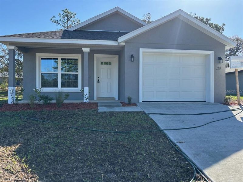 Front exterior of a new home in , Citrus Springs, FL, highlighting curb appeal (Image 16).