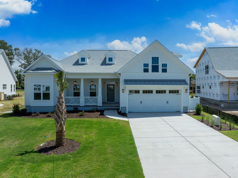 Representative exterior photo of a completed home built from the Claremont by Bill Clark Homes in The Sanctuary at Sunset Beach, Sunset Beach, NC (Image 26). Representative exterior photo of a completed home built from the Claremont by Bill Clark Homes in The Sanctuary at Sunset Beach, Sunset Beach, NC (Image 26).