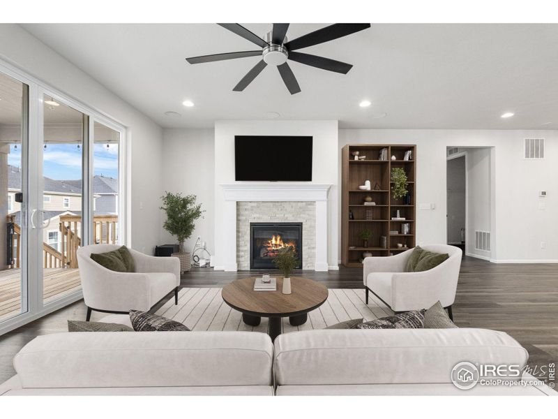 This photo has been virtually staged to provide visual ideas for how furniture can be arranged in this area of the home.