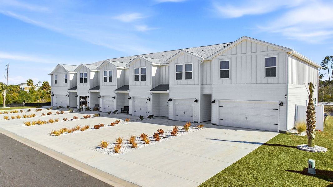 Front exterior of a new home in WindMark Beach, Port Saint Joe, FL, highlighting curb appeal (Image 2). Front exterior of a new home in WindMark Beach, Port Saint Joe, FL, highlighting curb appeal (Image 2).