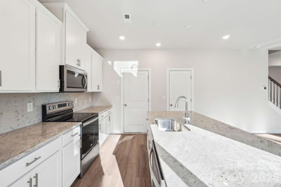 Photo is not of the actual home, but is an inspirational photo of builder’s model home and may depict options, furnishings, and/or decorator features that are not included