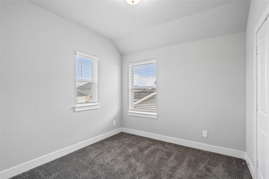Perfect for guests or a quiet home office, this room features soft, plush carpeting, windoww providing natural light, and ample walk-in closet space. Perfect for guests or a quiet home office, this room features soft, plush carpeting, windoww providing natural light, and ample walk-in closet space.