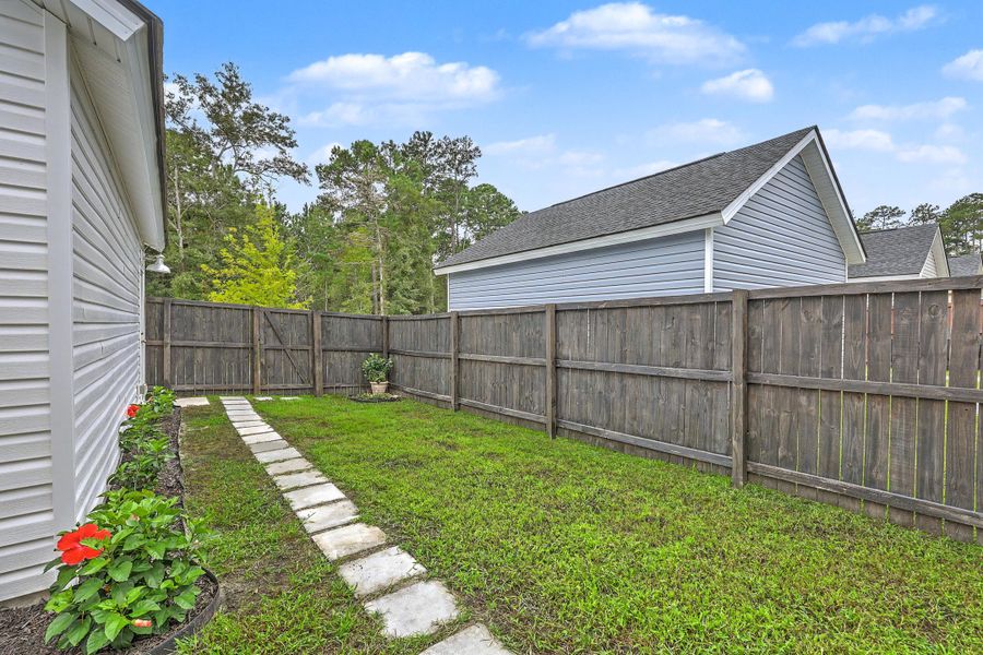Exterior details and patio area of a home in Limehouse Village: Row Collection, Summerville (Image 33).
