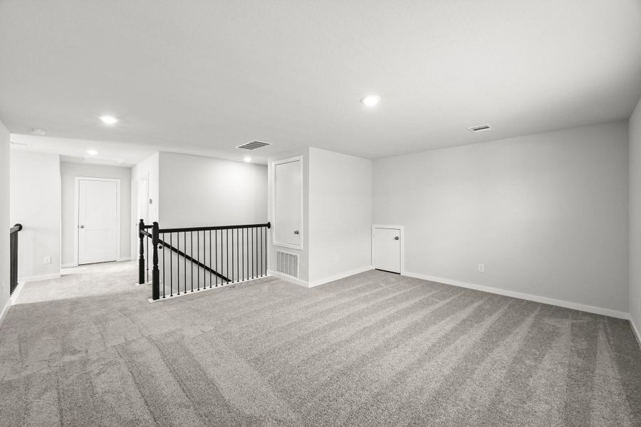 Spacious, unfurnished interior of a new home in Sunterra, Katy (Image 31).