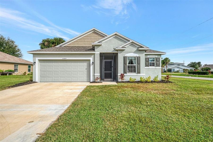 Front exterior of a new home in , Punta Gorda, FL, highlighting curb appeal (Image 1).